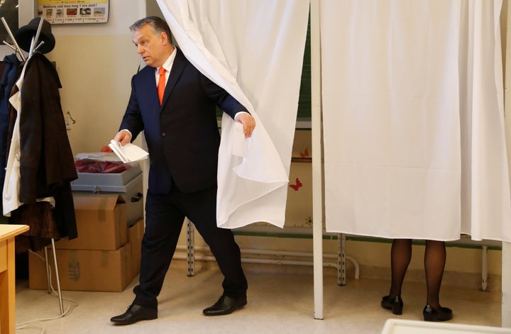 Hungarian Prime Minister Viktor Orbán leaves a polling booth.