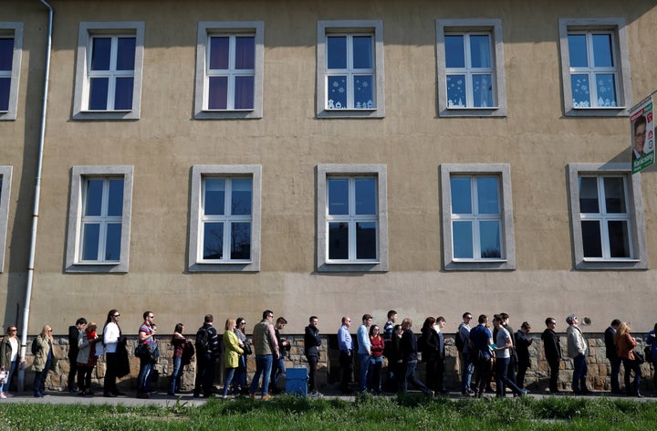 People wait in line to vote during Hungarian parliamentary elections at a polling station in Budapest, Hungary, on April 8, 2