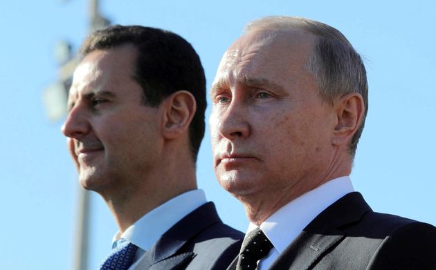 Russian President Vladimir Putin and Syrian President Bashar al-Assad visit the Hmeymim air base in Latakia Province, Syria December 11, 2017.