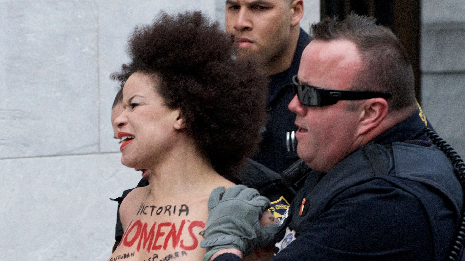 Topless Protester Arrested Outside Bill Cosby Retrial.