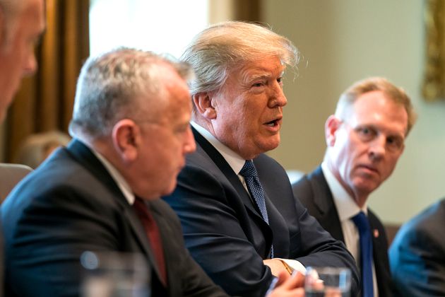 President Donald Trump speaks with the media at the White House.