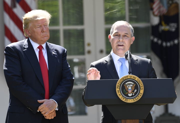 President Donald Trump looks on as Environmental Protection Agency Administrator Scott Pruitt speaks after announcing the U.S. withdrawal from the Paris climate agreement on June 1, 2017.