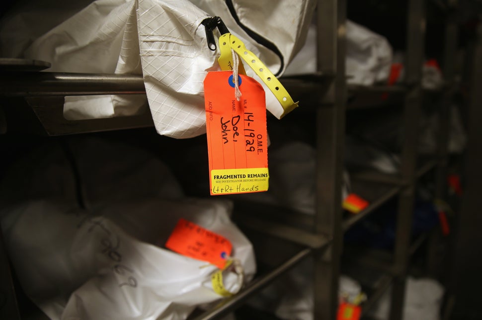 Human remains in body bags lie in the refrigerated morgue of the Pima County Office of the Medical Examiner in Tucson, Arizon