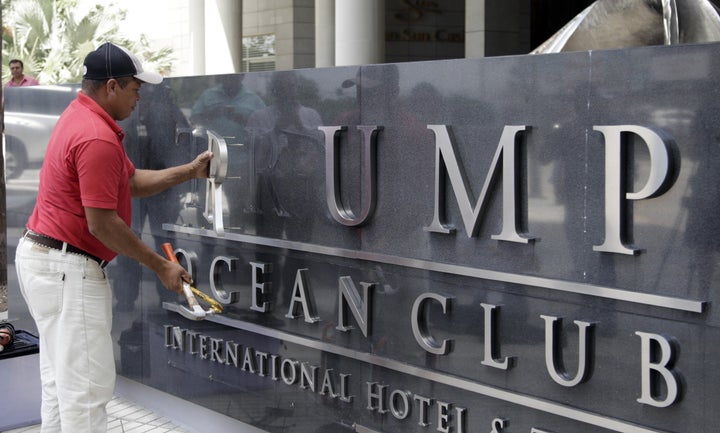 A worker removed the Trump name from a hotel in Panama City.