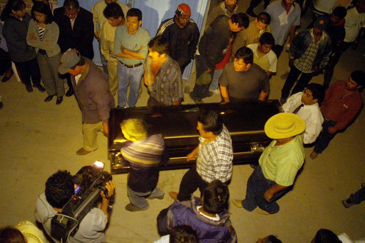 Relatives and neighbors carry the casket of a migrant who died in a truck in Victoria, Texas, on May 14, 2003.
