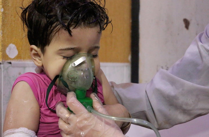 A Syrian child receives medical treatment after the chemical attack on Douma.