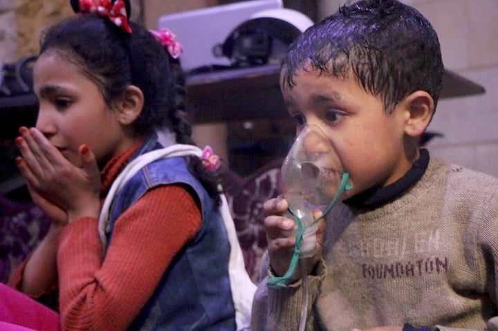 Syrian children receive medical treatment after a suspected poisonous gas attack in Damascus on April 7.