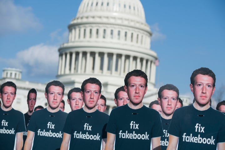 Cutouts of Facebook CEO Mark Zuckerberg appear on the Capitol grounds on Tuesday.