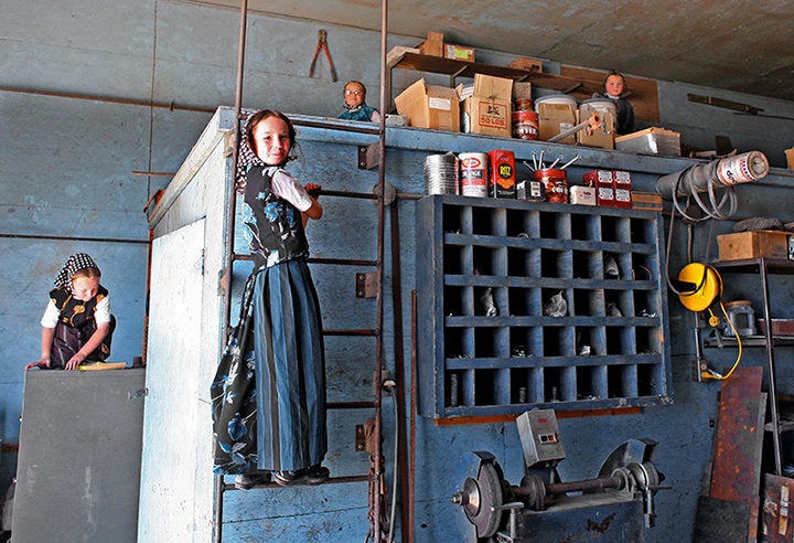 Hutterite children play in a warehouse. 