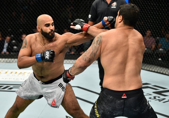 Arjan Singh Bhullar lands a punch against Luis Henrique in a September 2017 match.