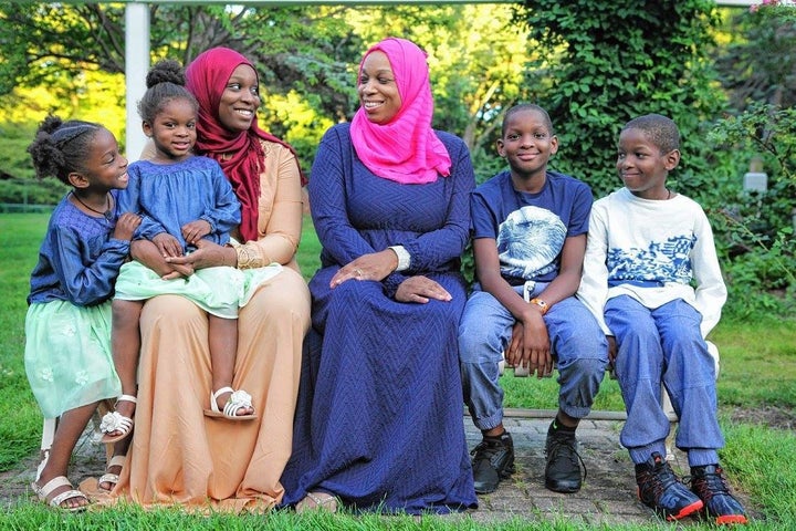 Tahirah Amatul-Wadud, center, with five of her seven children. She says the safety of her husband and especially her sons makes her more attuned to the risks black men face.