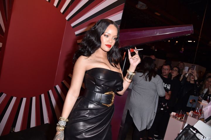 Rihanna holding up her Stunna lip paint. 