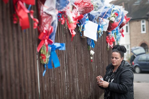 Police have urged residents of a south London street to be 'respectful' and allow the family of Henry Vincent to leave floral tributes at the scene of a burglary where he died