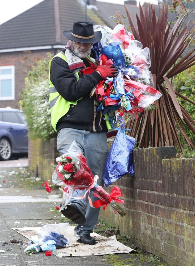 Gordon kicks the flowers down the road