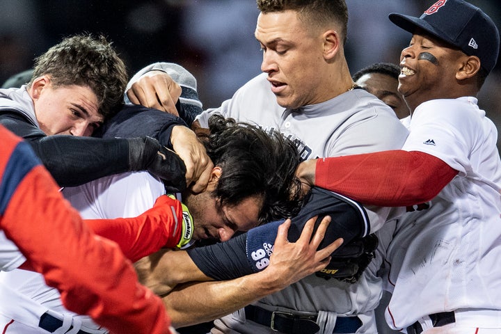 Aaron Judge #99 of the New York Yankees gets in the middle of the fray.