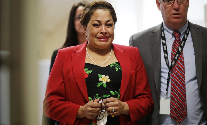 Chelan Lasha cries as she returns to the courtroom on Wednesday.