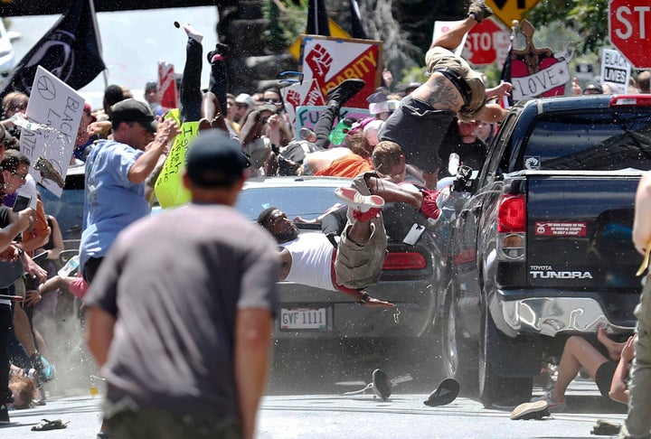 A vehicle drives into a group of protesters demonstrating against a white nationalist rally in Charlottesville, Virginia, on Aug. 12, 2017.