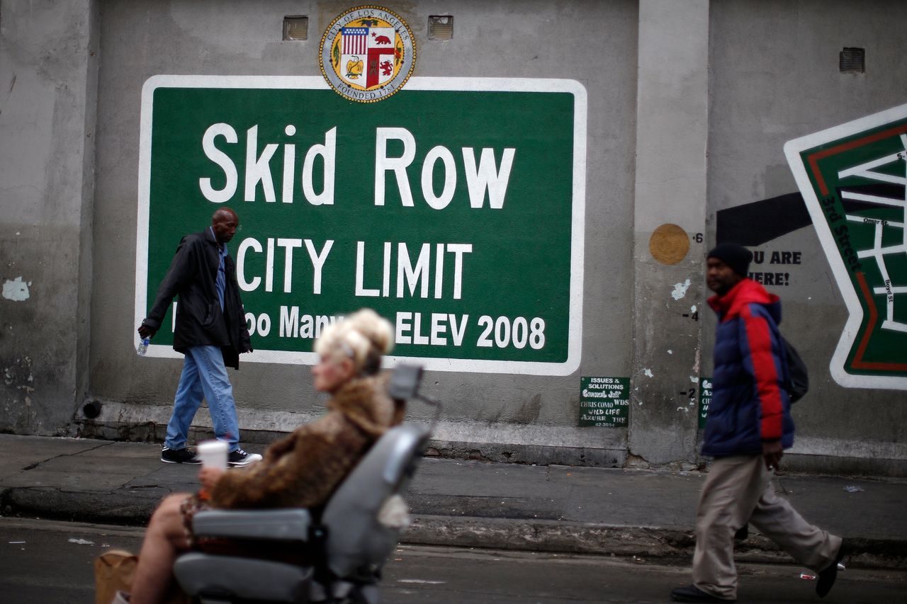 People view a memorial for a man killed by police in the Skid Row neighborhood of Los Angeles, March 2, 2015.