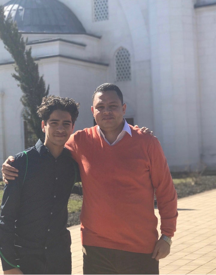 Yusef Haddabah (left) poses with his teacher Ahmed Abdelbasit on a school field trip.