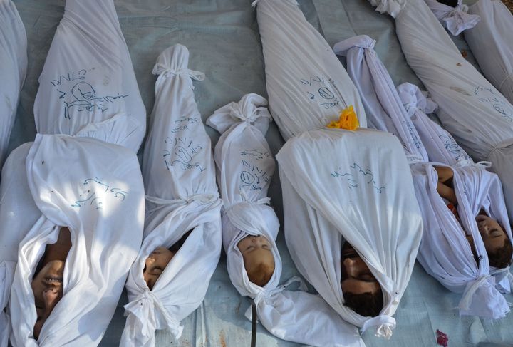 Bodies of people killed in the attack that Eid survived in 2013 in the Duma neighbourhood of Damascus. 