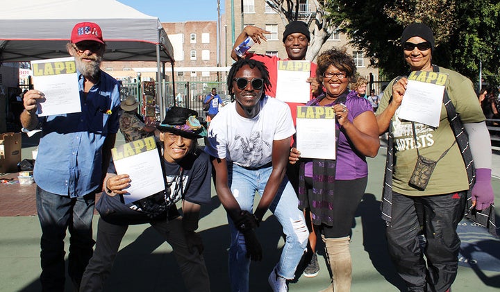 Djibril Drame celebrates the completion of his photography workshop with attendees.