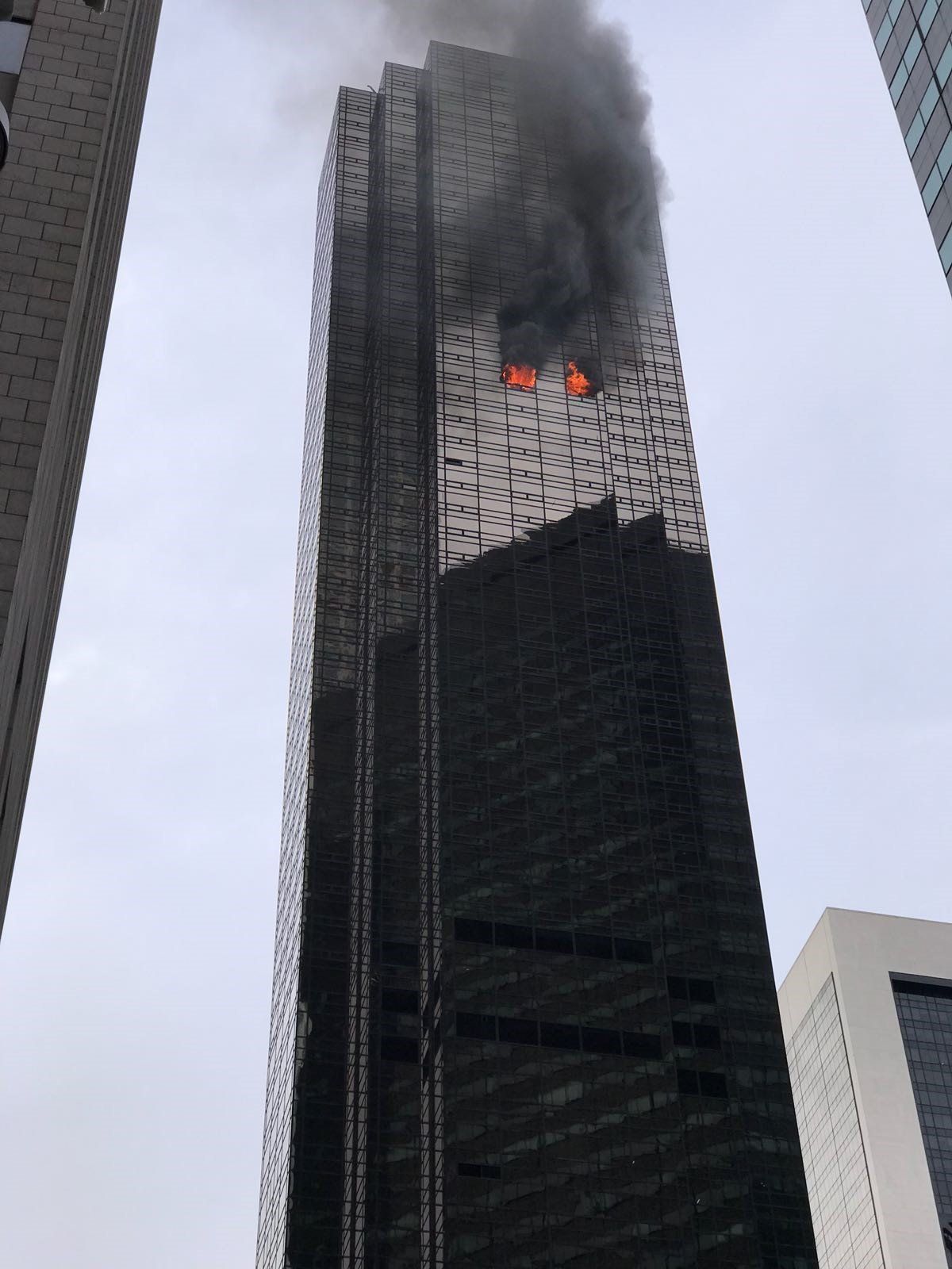 Smoke rises from the 50th floor of Trump Tower in Manhattan on April 7.