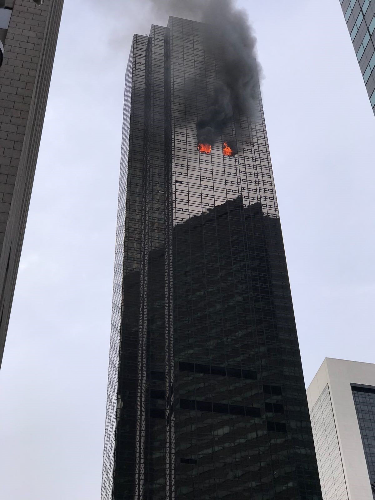 Smoke rises from the 50th floor of Trump Tower in Manhattan on April 7.