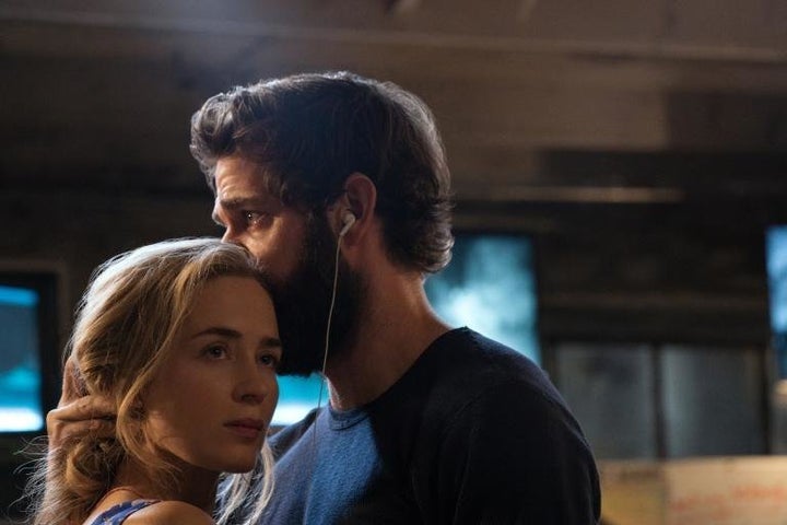 Evelyn Abbott (Emily Blunt) and Lee Abbott (John Krasinski) share a dance and headphones in "A Quiet Place."