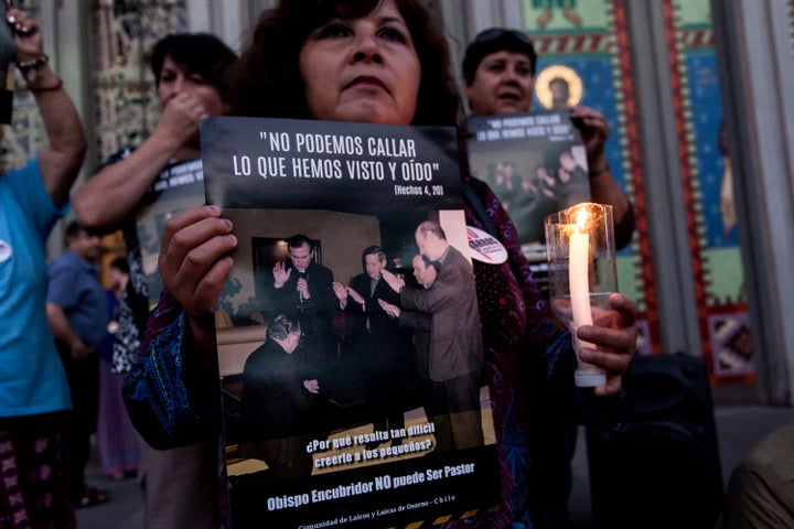 People protest against Juan Barros, current Bishop of Osorno, in front of a cathedral in Osorno, Chile, on Feb. 23, 2018. Abuse victims say Barros witnessed abuse by Chile’s the Rev. Fernando Karadima, who was convicted in 2011.