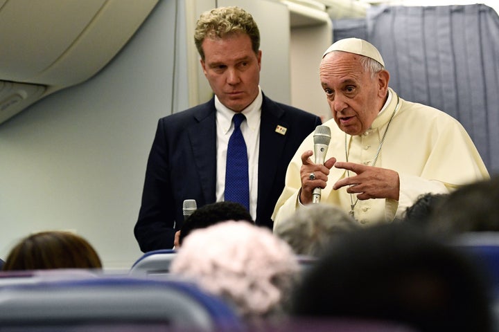 Pope Francis, with Vatican spokesman Greg Burke, speaks to reporters during his return flight from a trip to Chile and Peru on Jan. 22, 2018.