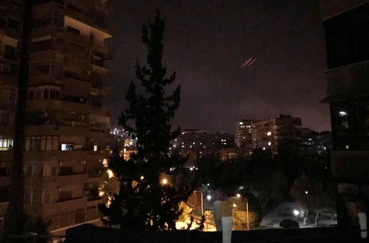 Anti-aircraft fire is seen over Damascus on Saturday.