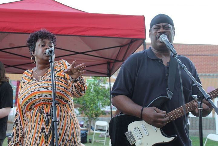 Franc’s Melting Pot performs with singer Demetra Wilson-Washington, left, on the event stage at Gladys Park.