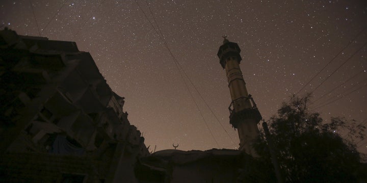 The night sky over a mosque in Aleppo. A huge blast was heard in a government-controlled rural region south of Aleppo on Saturday night.