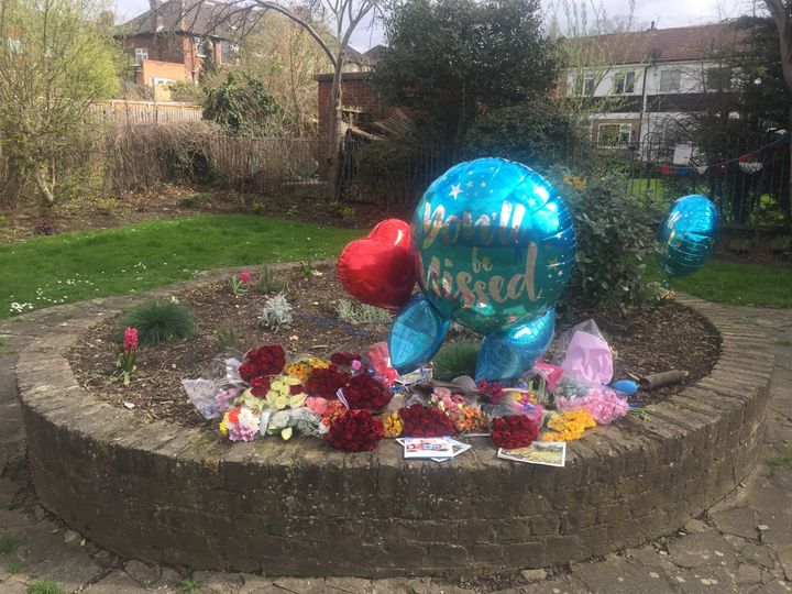 The tributes have now been moved to a community garden nearby