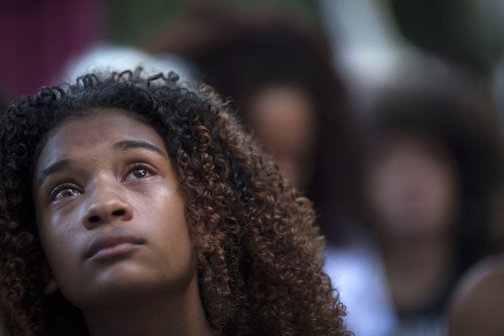 A protester cries during a March 20 demonstration against the killing of Marielle Franco in front of the Municipal Chamber of Rio de Janeiro.