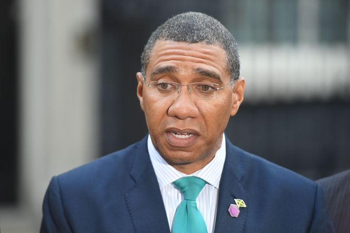 The Prime Minister of Jamaica Andrew Holness talks to the waiting media in arriving in Downing Street after the meeting with Prime Minister Theresa May 