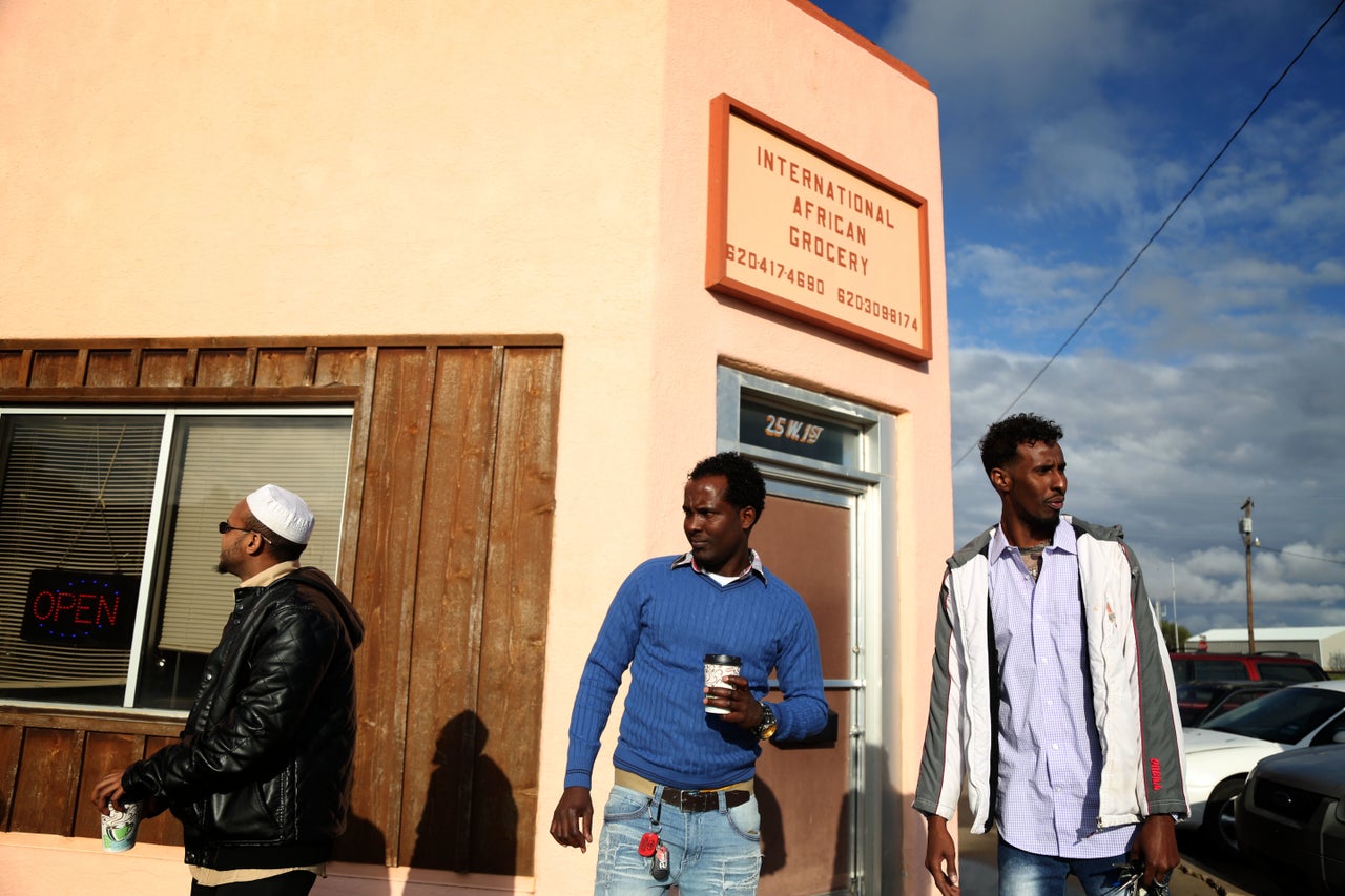 Somali men gather outside the International African Grocery Store in Liberal, Kansas. Employment at the local National Beef plant has brought a wave of Somali immigrants to southwest Kansas.