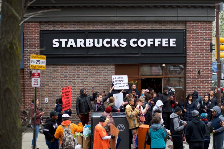 Protesters demonstrate on Sunday outside the Philadelphia Starbucks where two black men were arrested last week.