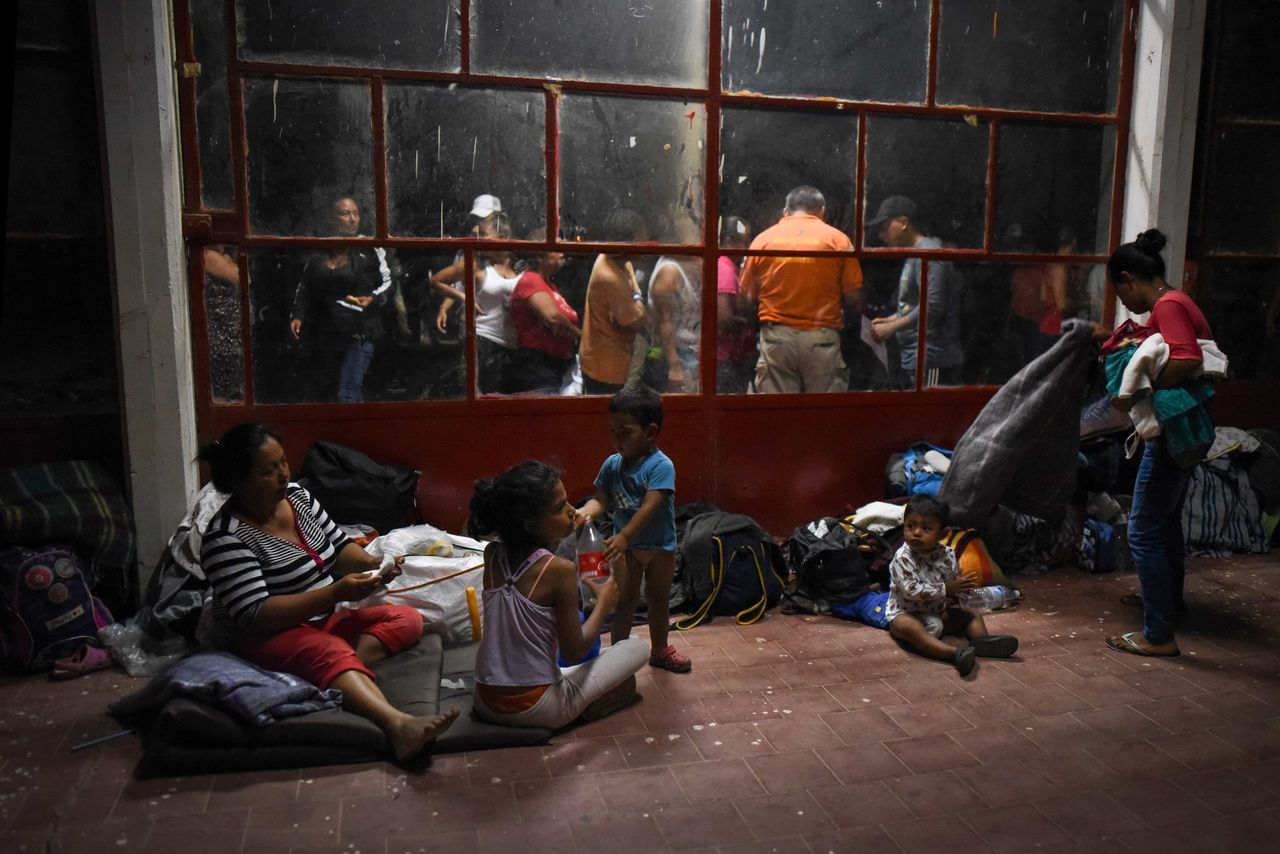 Central American migrants rest at a sports center field in Matias Romero, Mexico, on April 2.