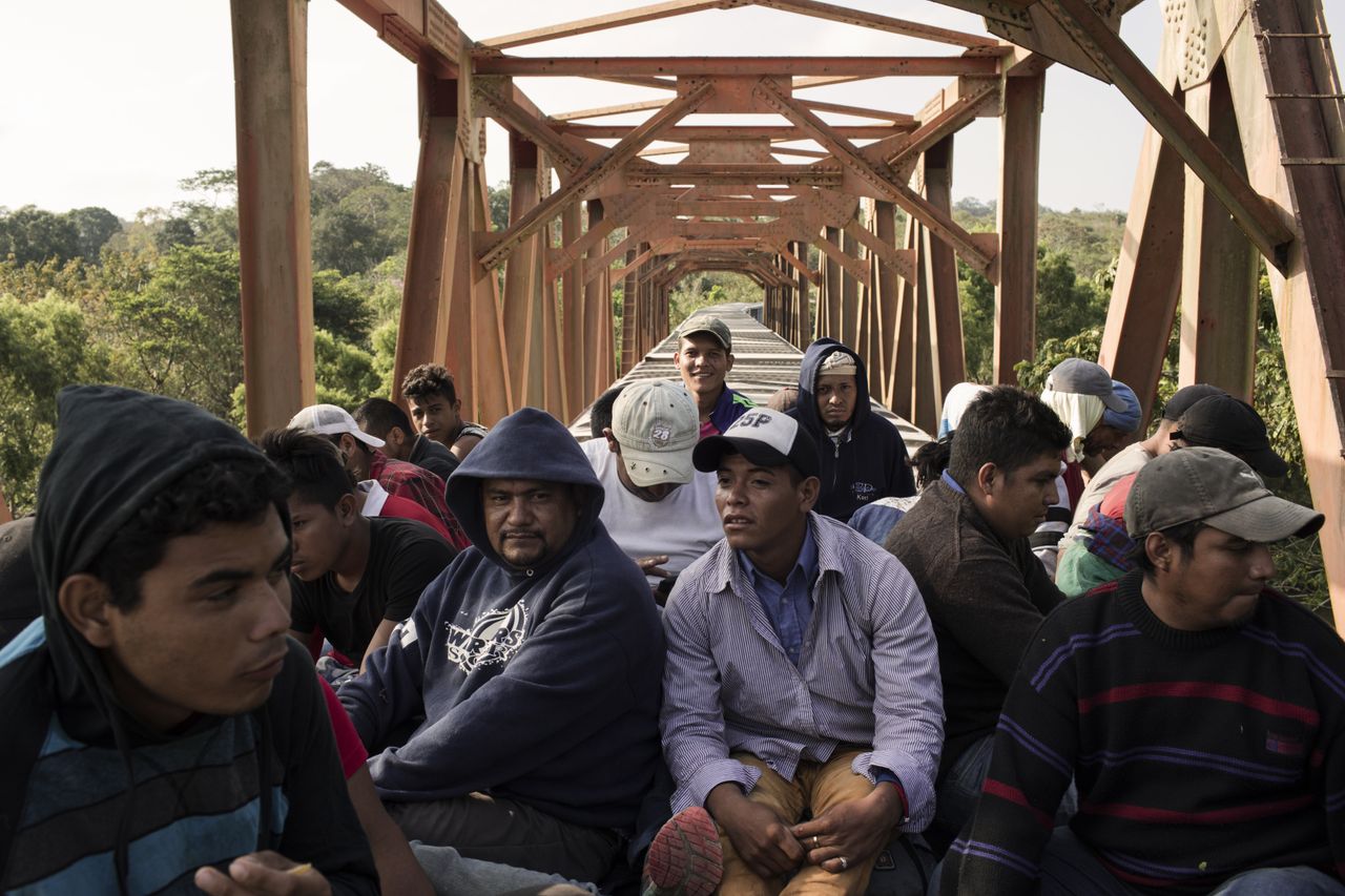 Central American migrants ride the freight train called "The Beast" in Matias Romero, Mexico, on April 1.