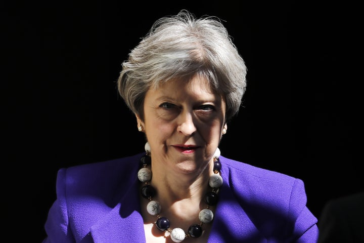 Britain's Prime Minister Theresa May said she “deeply” regretted the UK’s role in fueling “discrimina