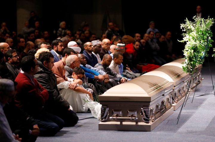 Mourners listen during funeral services for three of the victims of the deadly shooting at the Quebec Islamic Cultural Centre, located at the Congress Centre in Quebec City, on Feb. 3, 2017.