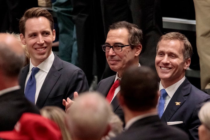 State Attorney General Josh Hawley (left) and Gov. Eric Greitens flank U.S. Treasury Secretary Steven Mnuchin at a Trump rall