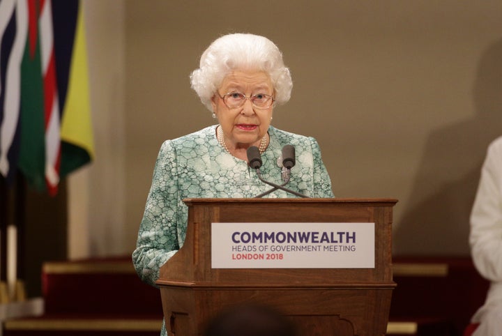 Queen Elizabeth II gives a speech at the formal opening of the Commonwealth Heads of Government Meeting at Buckingham Palace