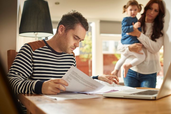 Parents working full-time earning less than £8.75 an hour say they worry about finances, poll finds (stock photo).