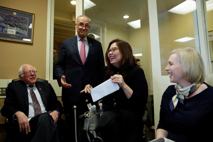 Senators laughing before a March 2017 news conference to introduce (again) the FAMILY Act.