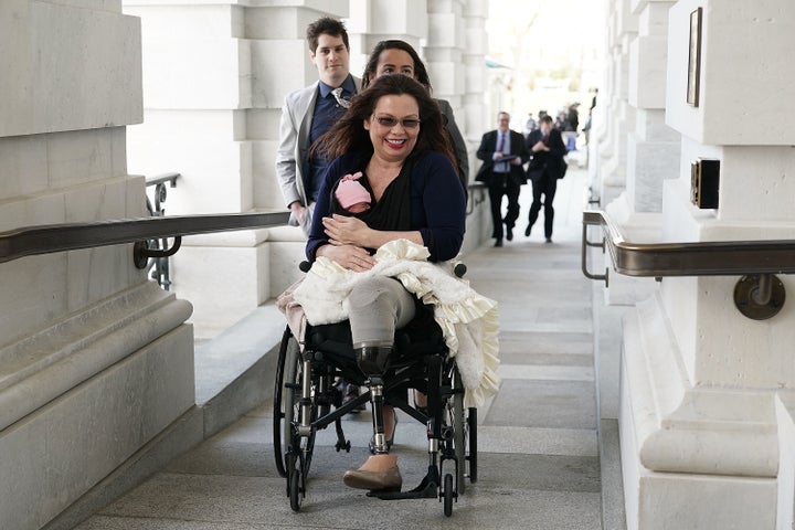 Sen. Tammy Duckworth (D-Ill.) arrives at the U.S. Capitol with her newborn baby daughter Maile Pearl Bowlsbey for a vote on the Senate floor.