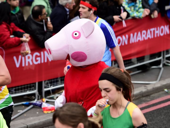 Running the London Marathon in record temperatures AND fancy dress could be risky this year. Pictured are runners in the 2015 London Marathon 