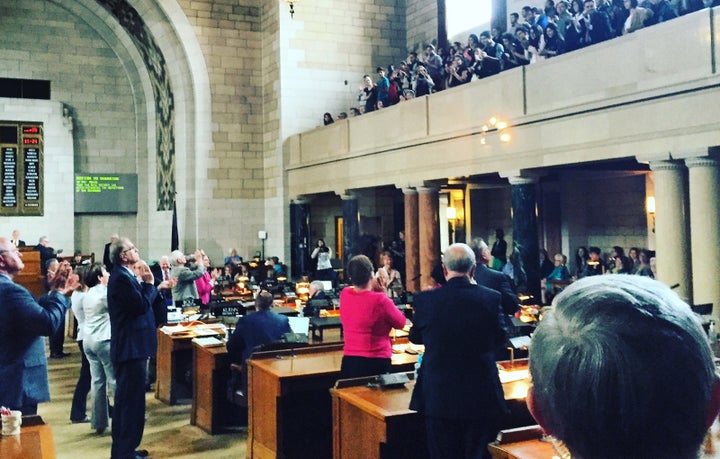 <p>Nebraska senators on the floor of the Legislature give a standing ovation to young immigrants in the gallery in 2016 after they overrode the governor’s veto and enacted a law paving the way for professional licenses.</p>