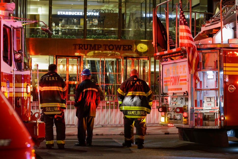 Firefighters at Trump Tower on April 7 in Manhattan. Six firefighters were injured battling the blaze that broke out on